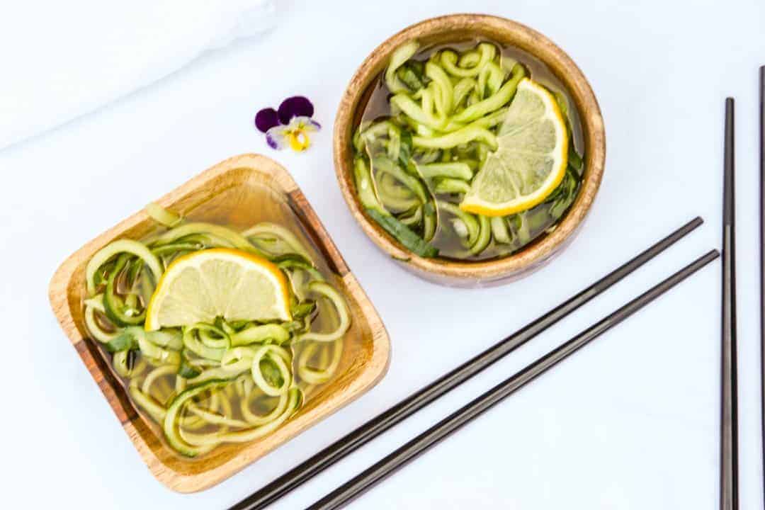 Two bowls of salad on a table