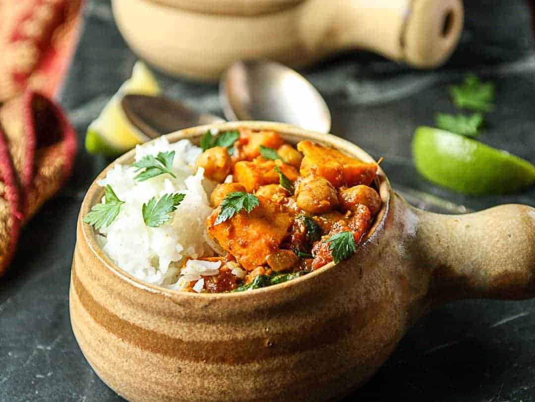 A close up of a bowl of curry on a table