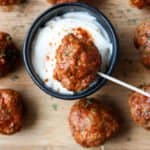 Meatballs and dip on a cutting board
