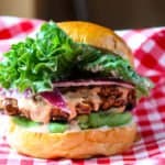 A hamburger sitting on top of a table