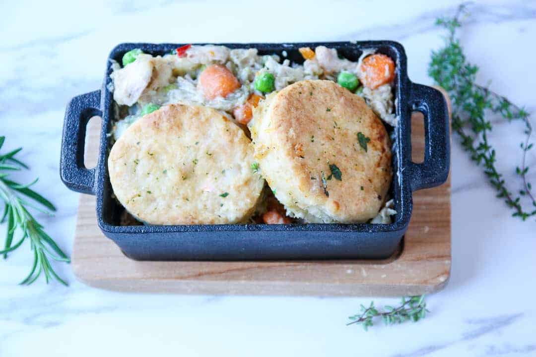 A pan of food, with Chicken and Biscuits