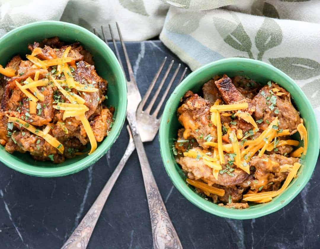 A green bowl filled with Bread pudding