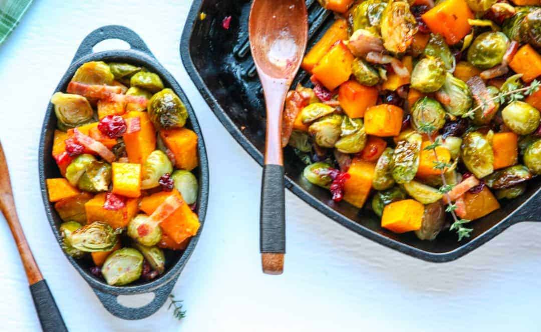 A dish is filled with food, with Brussels sprouts and Butternut squash
