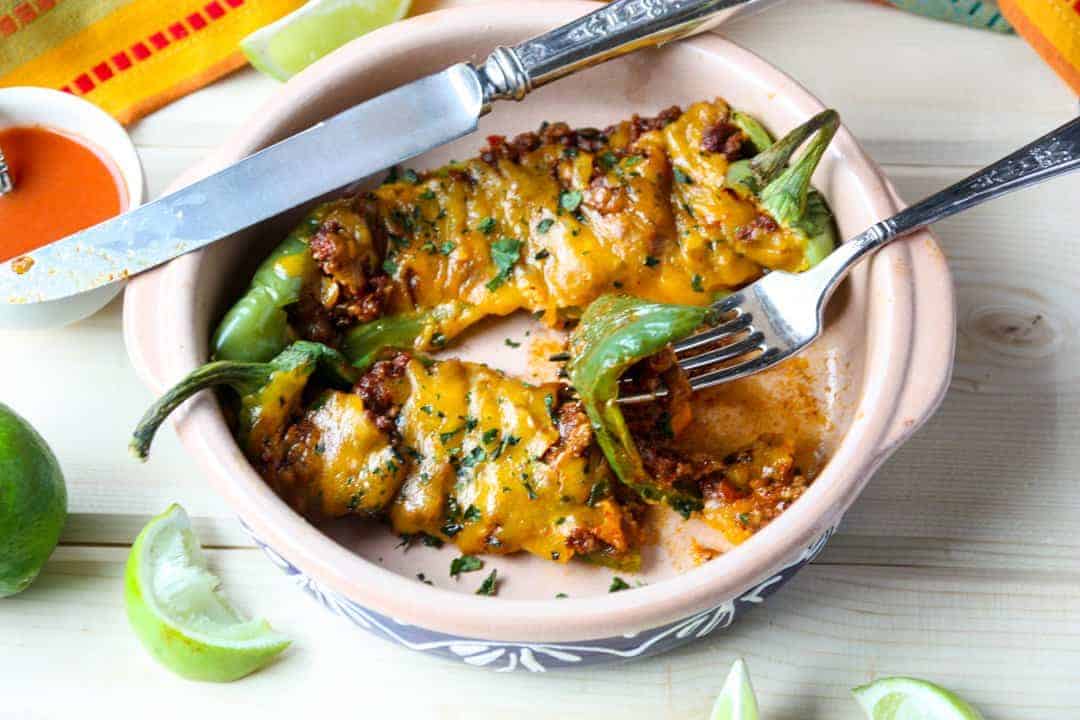 A plate of food on a table, with Peppers and Stuffing