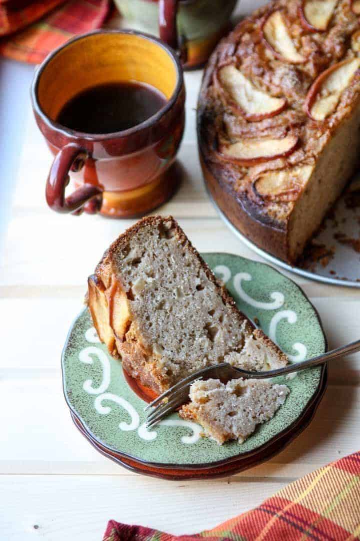 Slice of Apple Ricotta Cake on a Plate with Cup of Coffee