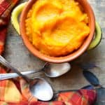 A serving dish of roasted garlic butternut squash puree