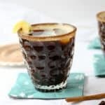 A rum cocktail in a glass on a table