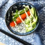 A bowl of food with avocado