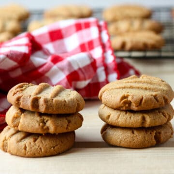 Two stacks of 3 gluten-free peanut butter cookies.