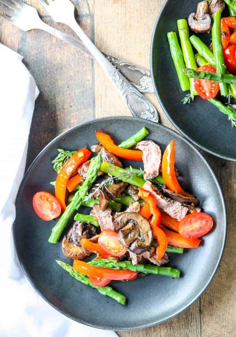 A bowl of food on a plate, with Steak