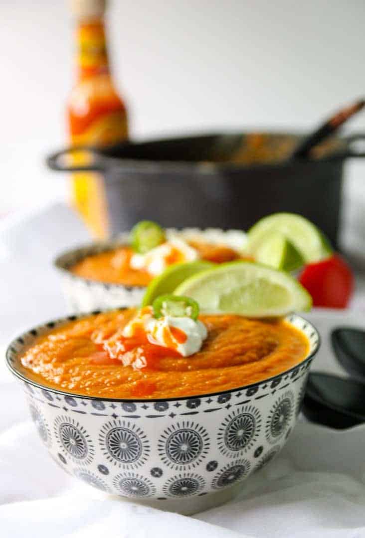 A bowl of soup on a plate