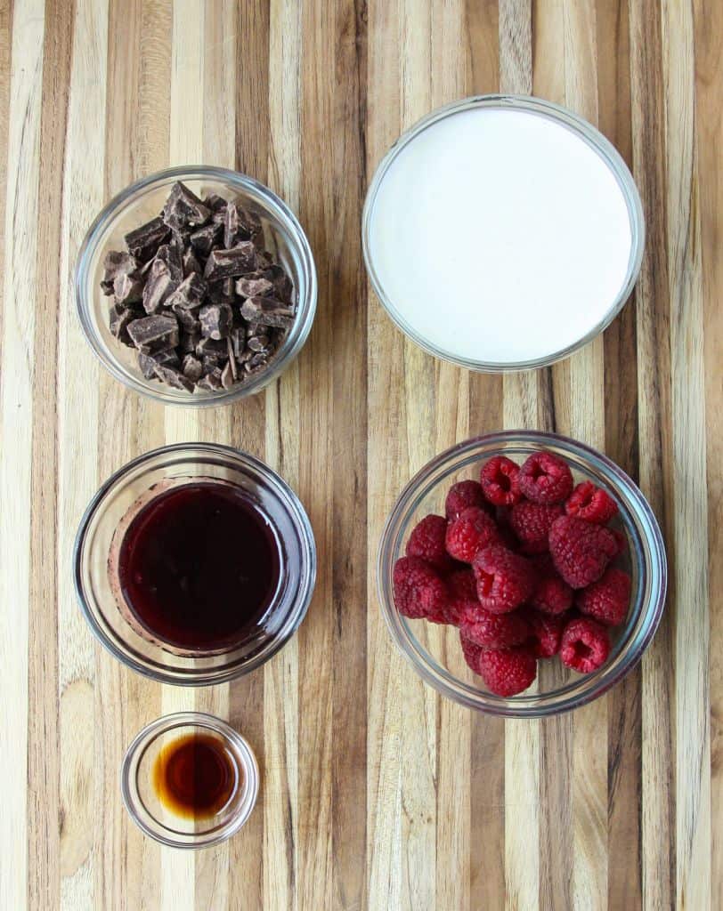 The ingredients to make this recipe in glass bowls on a wooden board.