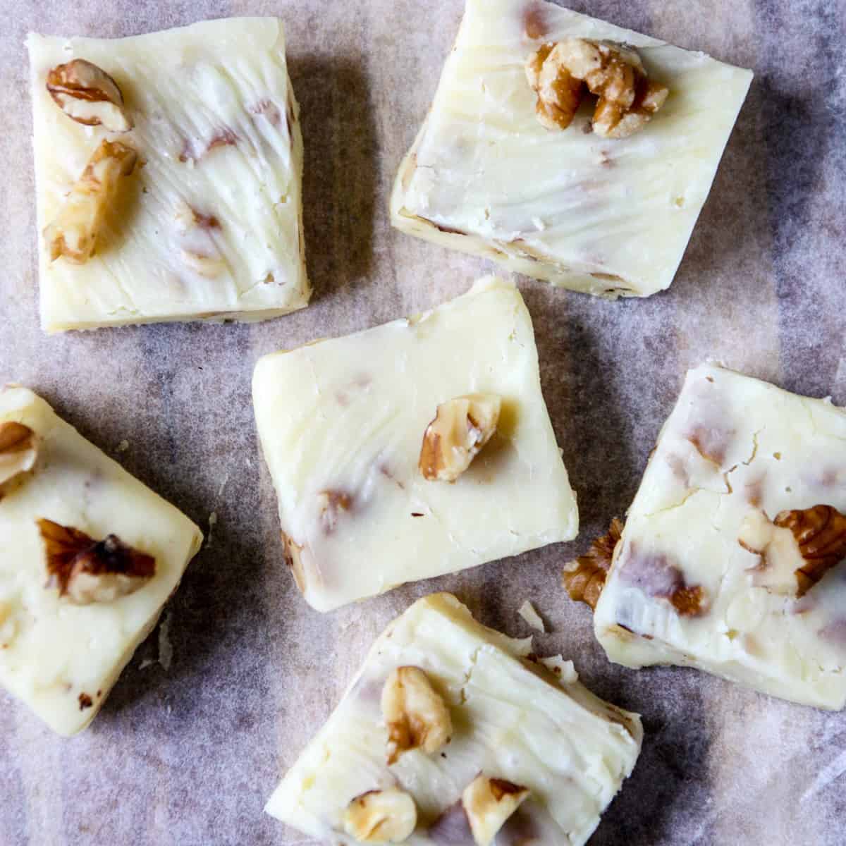 Fudge pieces on parchment paper.