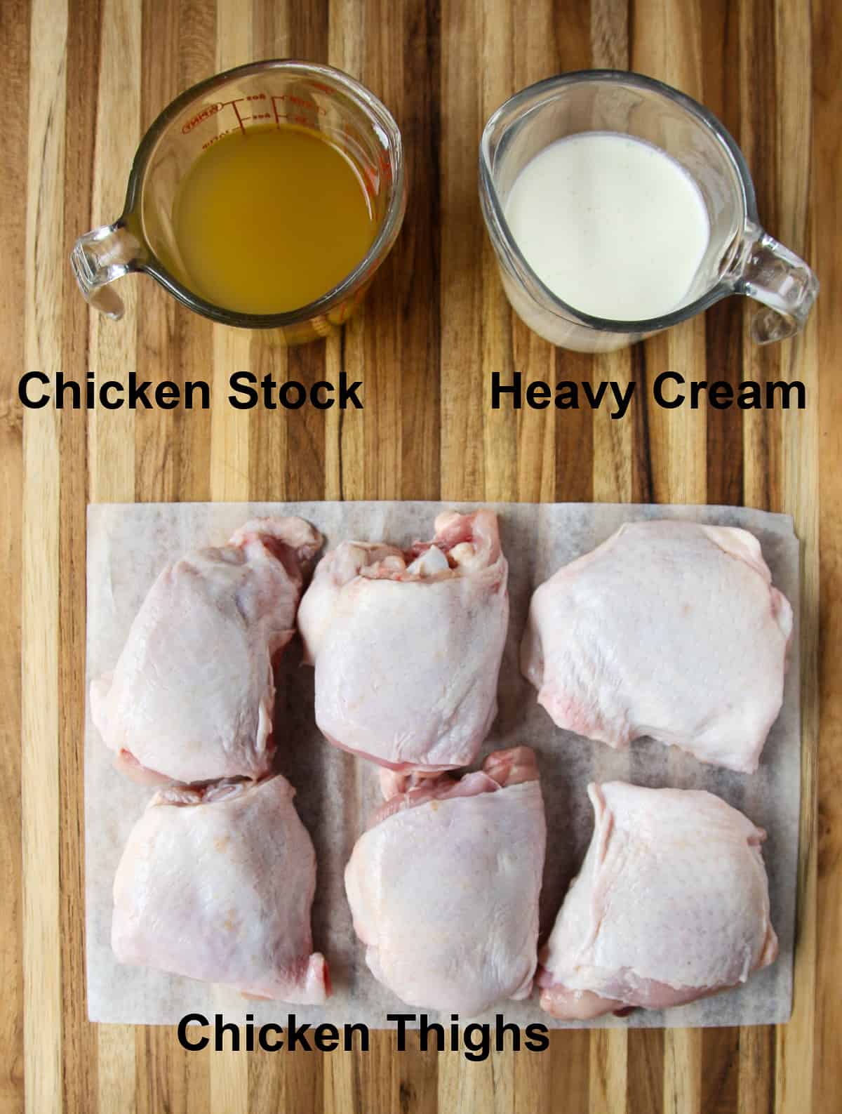 The main recipe ingredients on a wooden cutting board.