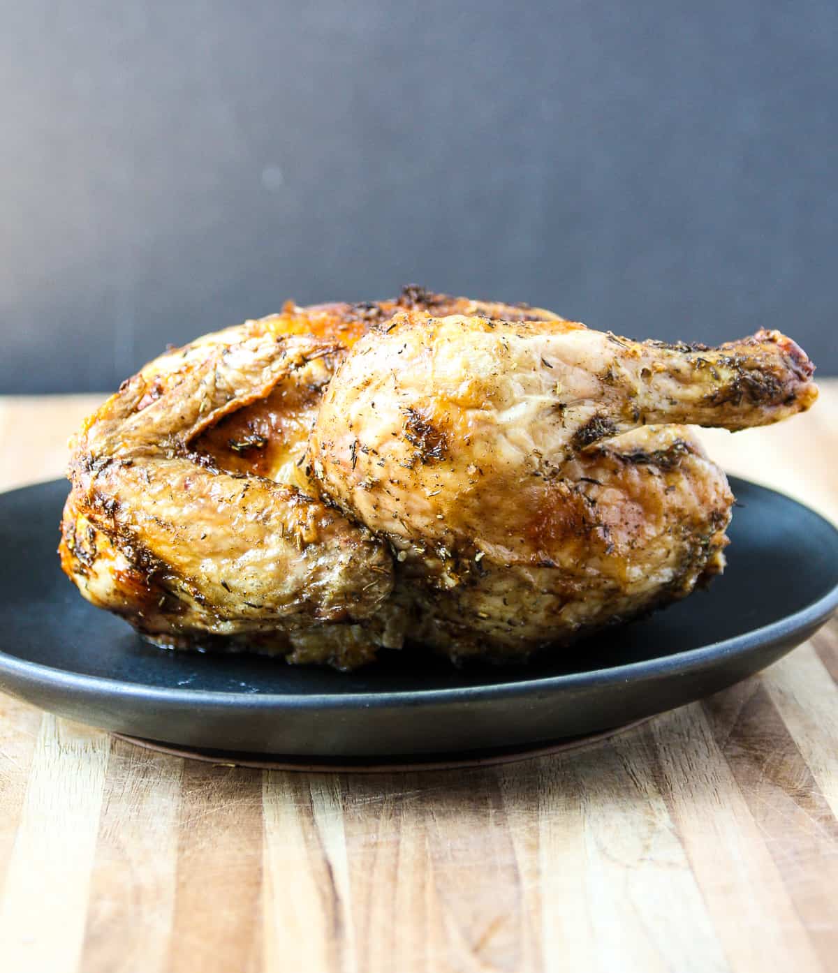 The air fried Cornish hen resting on a plate.