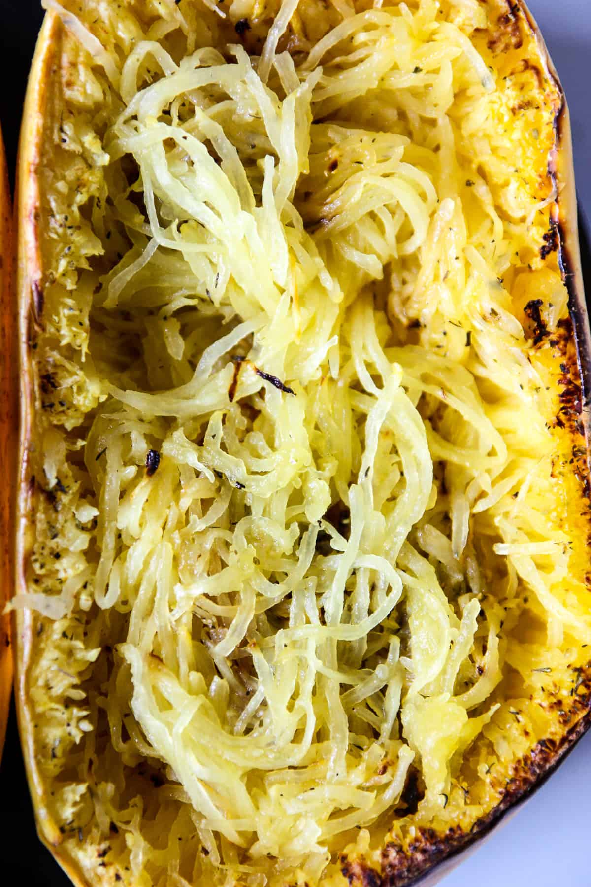 A close up of cooked air fryer spaghetti squash strands.