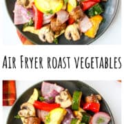 Colorful roasted vegetables on a black plate.