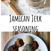 Jerk seasoning in a glass jar on a marble table.