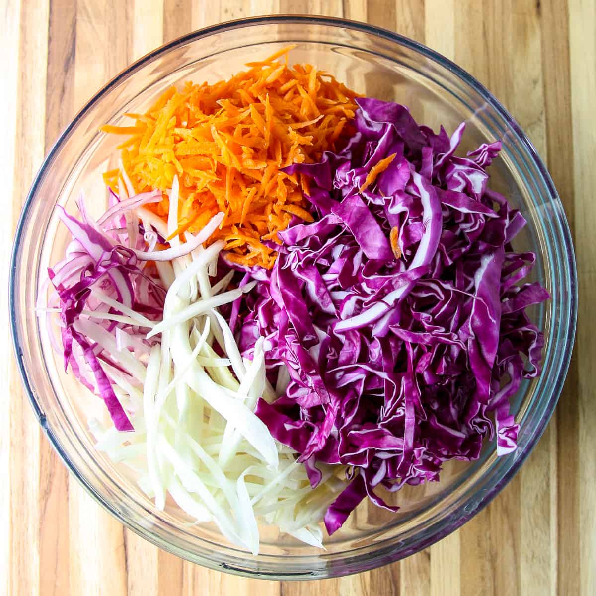 The vegetables for the salad in a glass bowl.