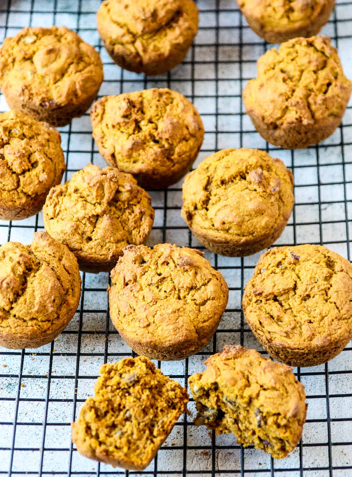 Muffins cooling on a wire rack.