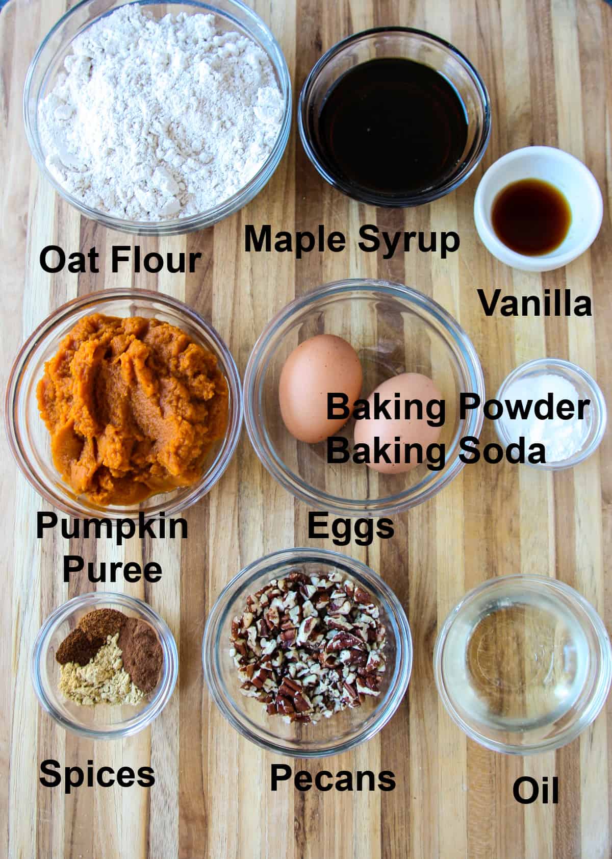 All of the ingredients for making this recipe in glass bowls on a wooden board.