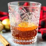 A gingerbread old fashioned cocktail in a glass.