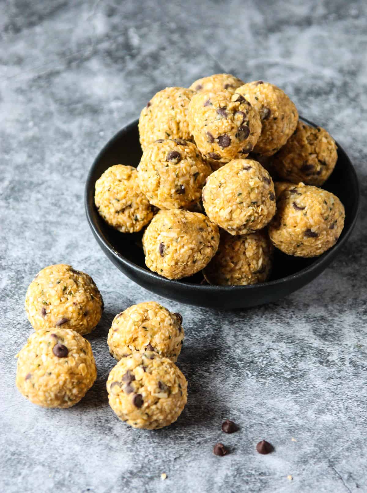 Oatmeal bites piled into a black dish.