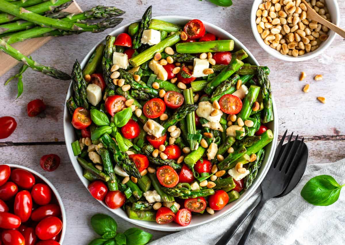 A colorful asparagus salad in a bowl.
