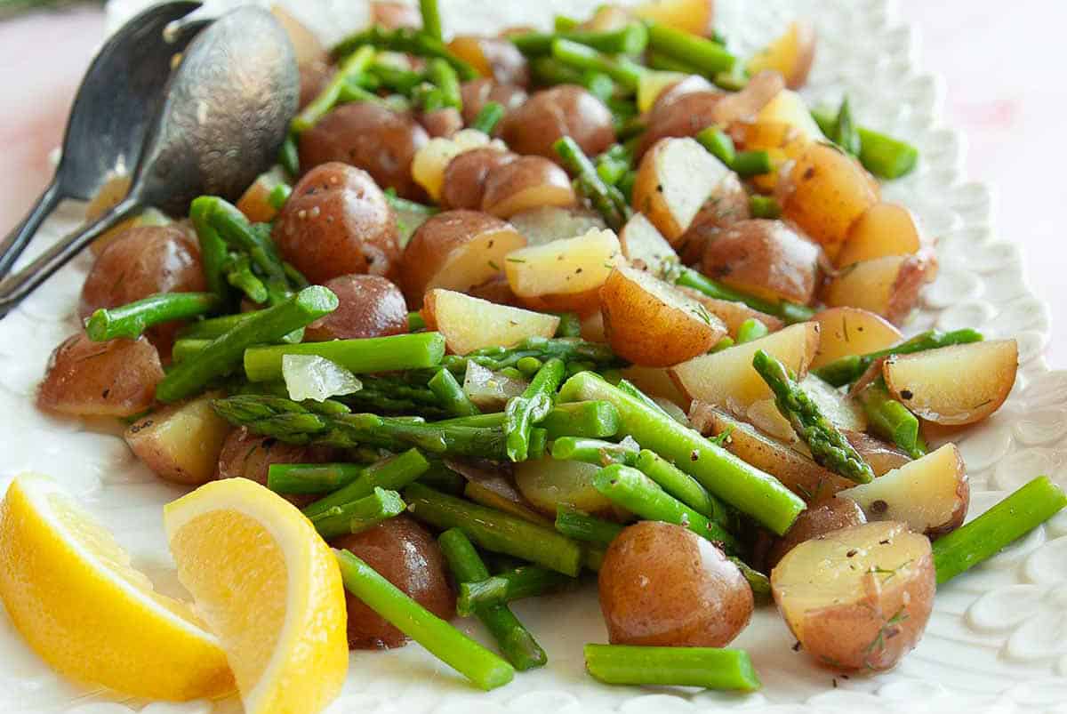 Potato and asparagus salad on a plate.