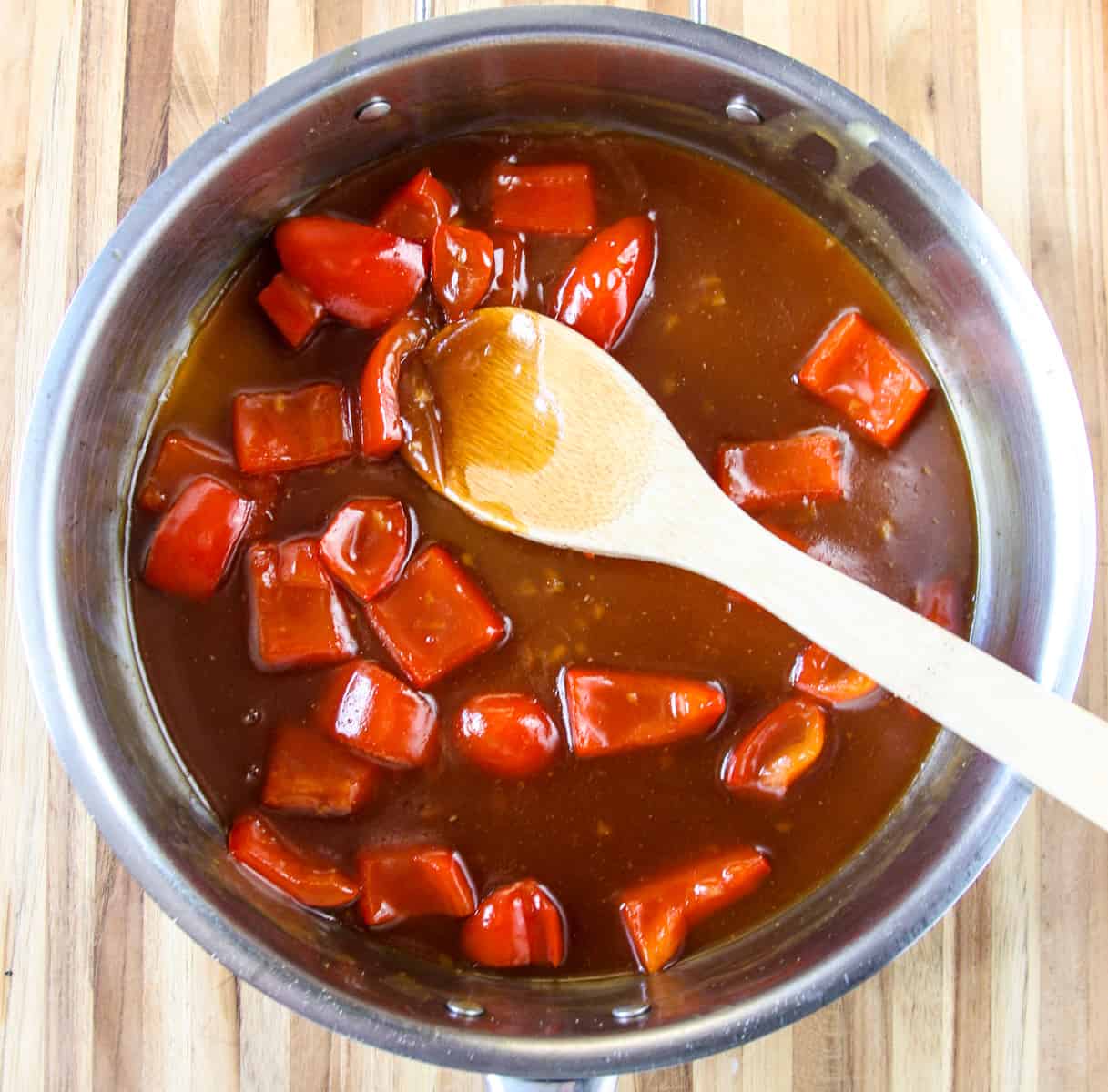 The thickened sauce with pepper slices added.